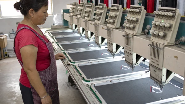An operator working at an embroidery machine